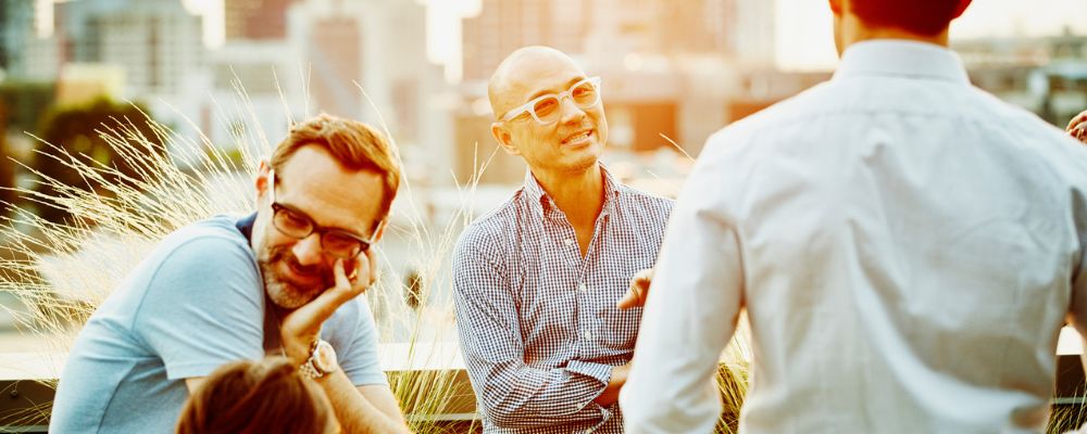 Group of men chatting outside